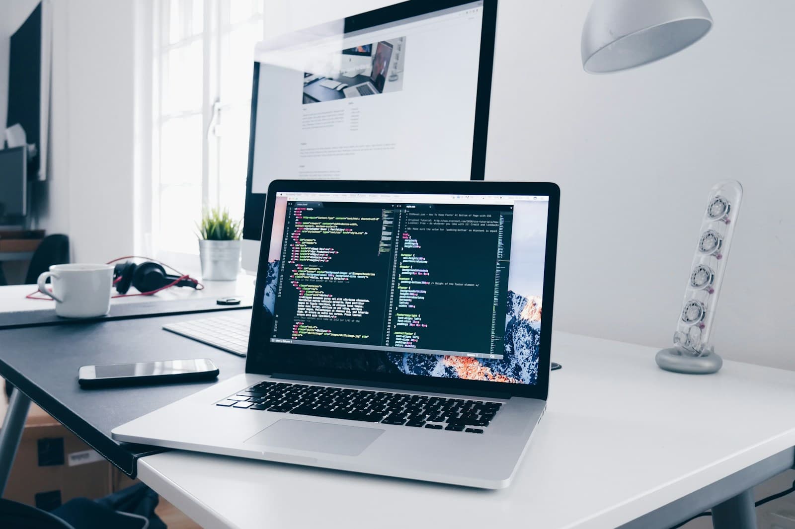Code displayed on a developer's laptop
